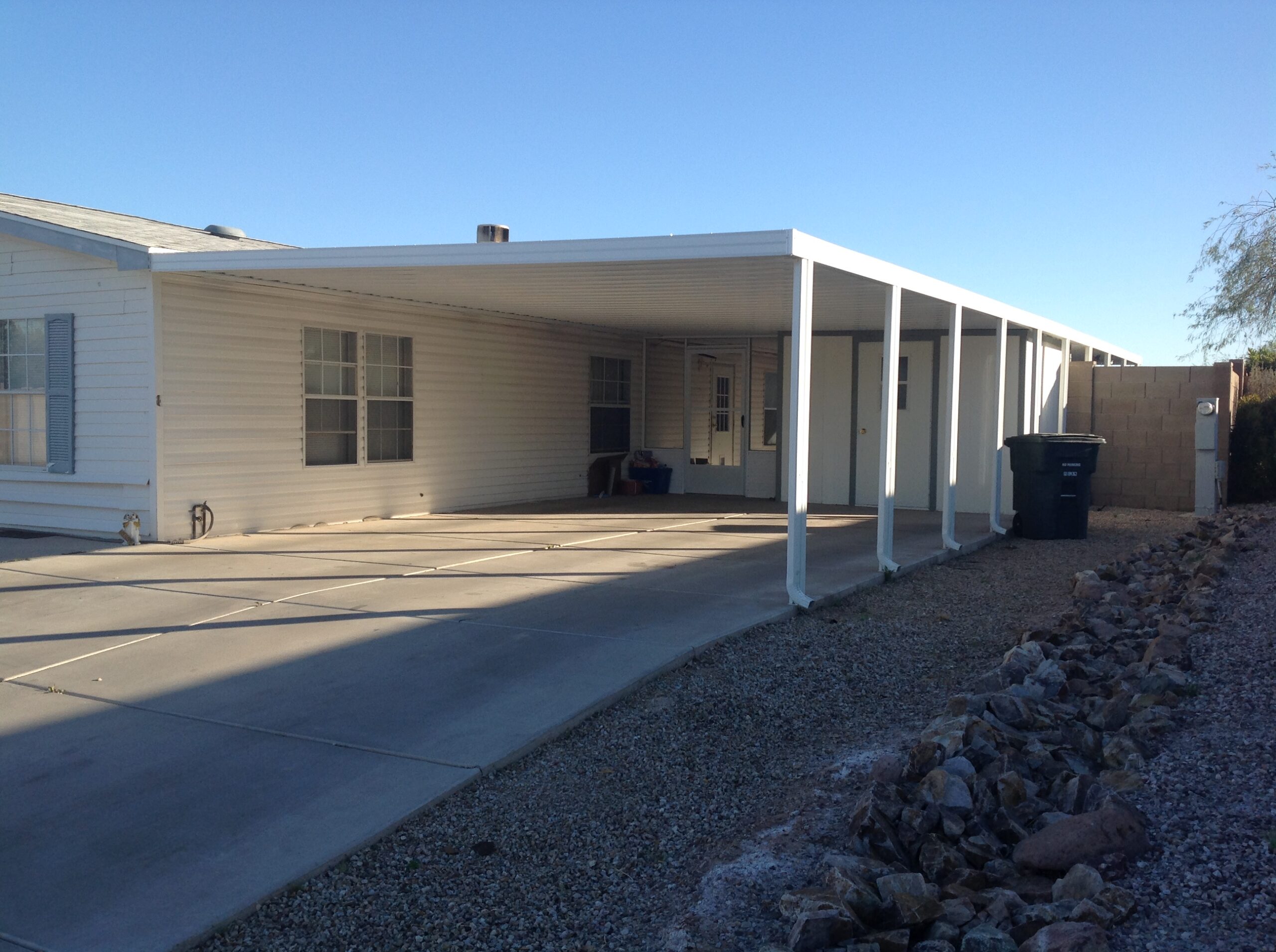 W-pan carport with gutter on each post